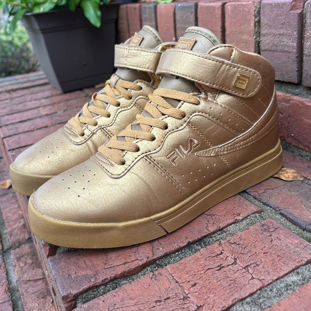Fila Vulc 13 sneakers in a gold colorway. Y2K